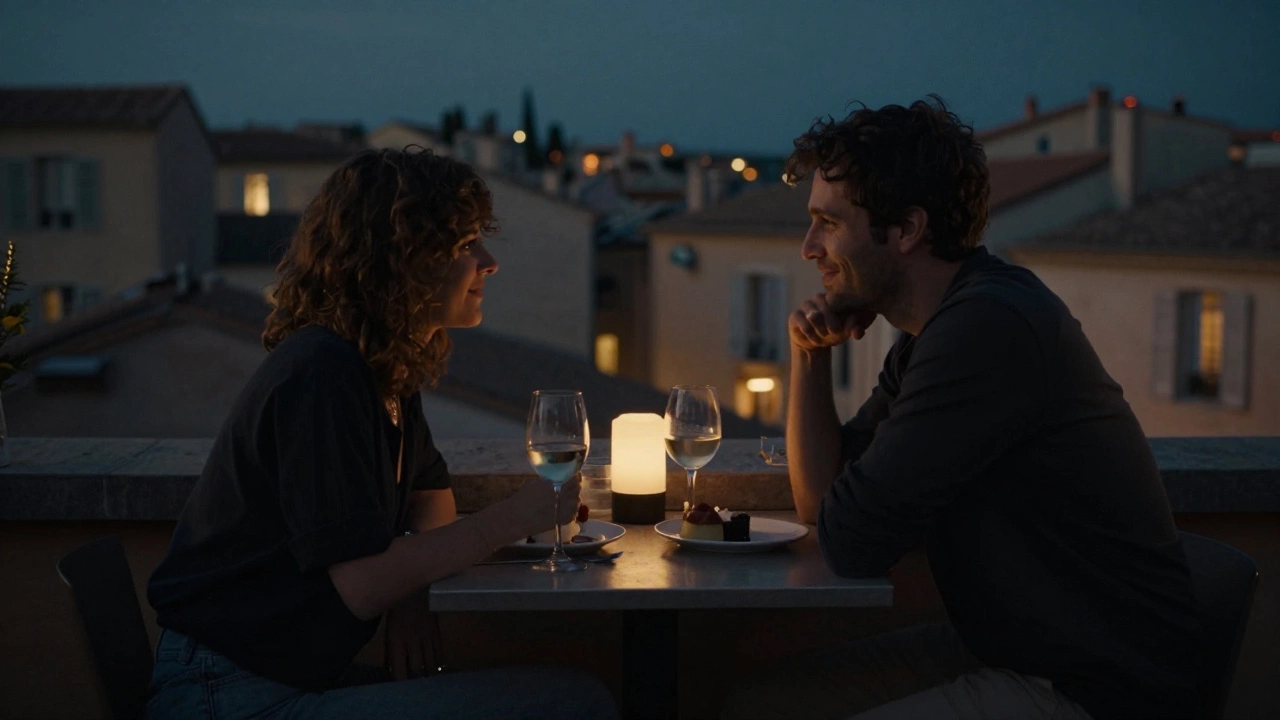 A couple sharing wine and conversation at a quiet rooftop bar in Aix-en-Provence.